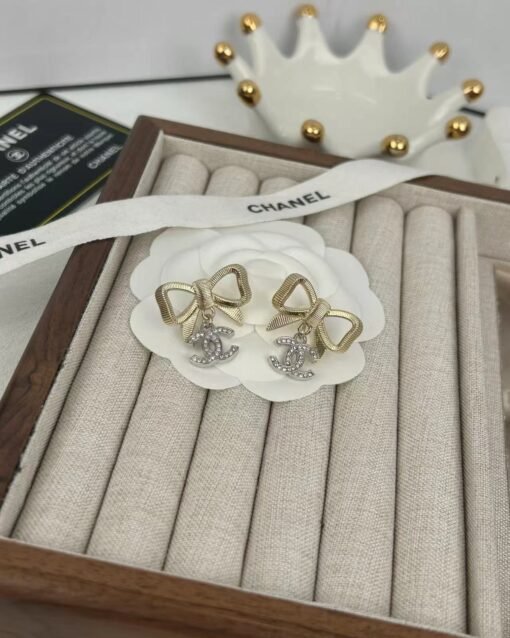 Chanel new style golden bow silver full diamond double c pendant
 Light luxury high-end earrings