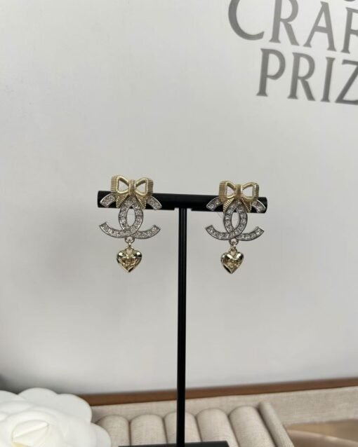 Chanel new style gold bow silver double c full diamond earrings - Image 4