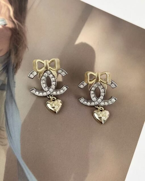 Chanel new style gold bow silver double c full diamond earrings - Image 3