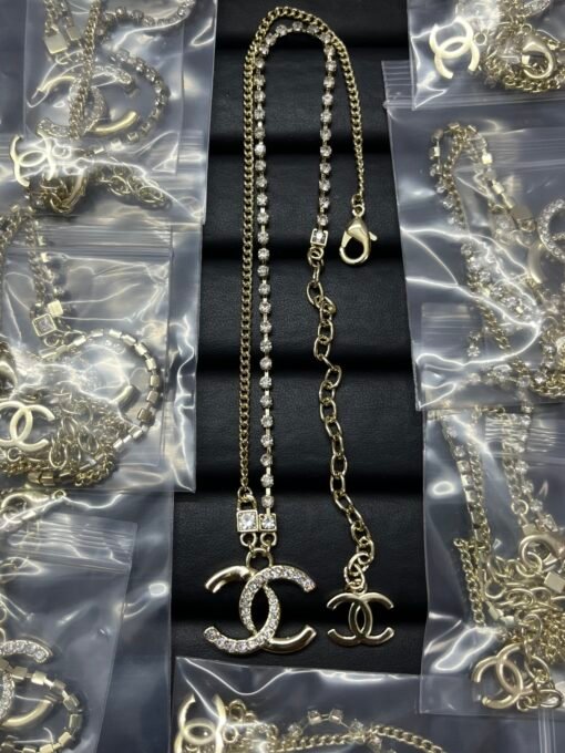 Chanel new square rhinestone asymmetric double c necklace