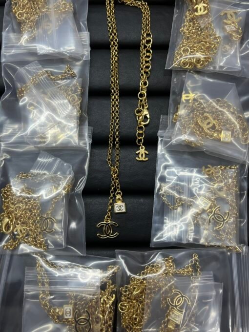 Chanel new double c drip oil black and white square tassel necklace